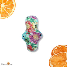 Load image into Gallery viewer, 10 inch assymetrical heavy absorbency reusable cotton pads, sanitary napkins, reusable pads, spring floral, front bleeder, back bleeder pad