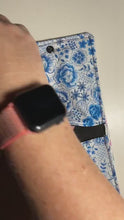 Load and play video in Gallery viewer, re:wrap pad wrapper, two pocket pad case
